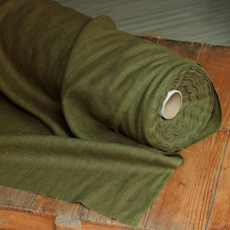 Olive green linen fabric roll on wood box