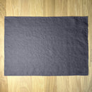 Anthracite gray linen placemat on wooden table