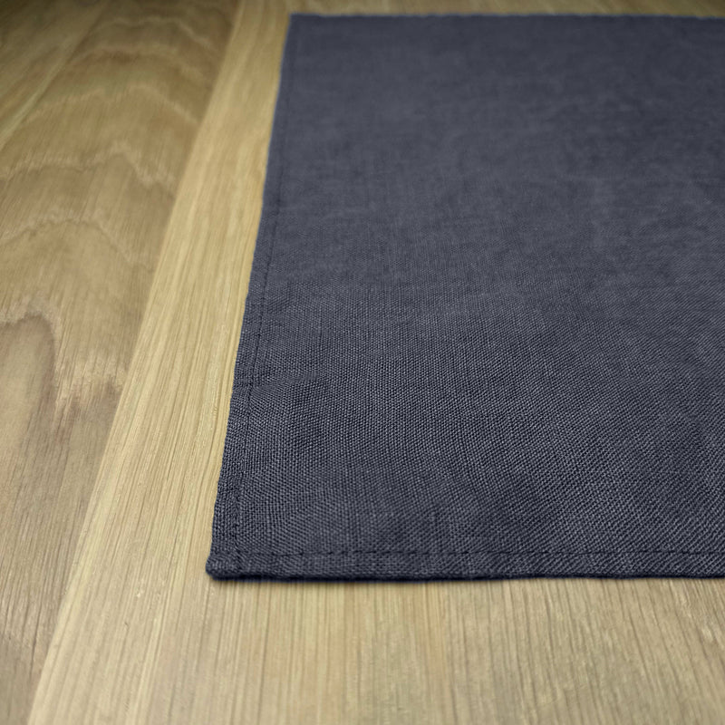 Corner-of-Anthracite-gray-linen-placemat-on-wooden-table
