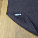 Corner-with-lable-of-LinenFriday-of-Anthracite-gray-linen-placemat-on-wooden-table