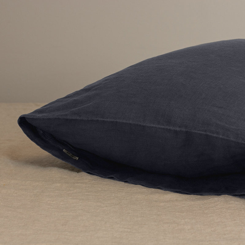 Corner of Linen pillow in anthracite gray pillowcase