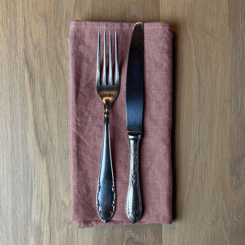 Fork-and-knife-on-desert-rose-linen-napkin