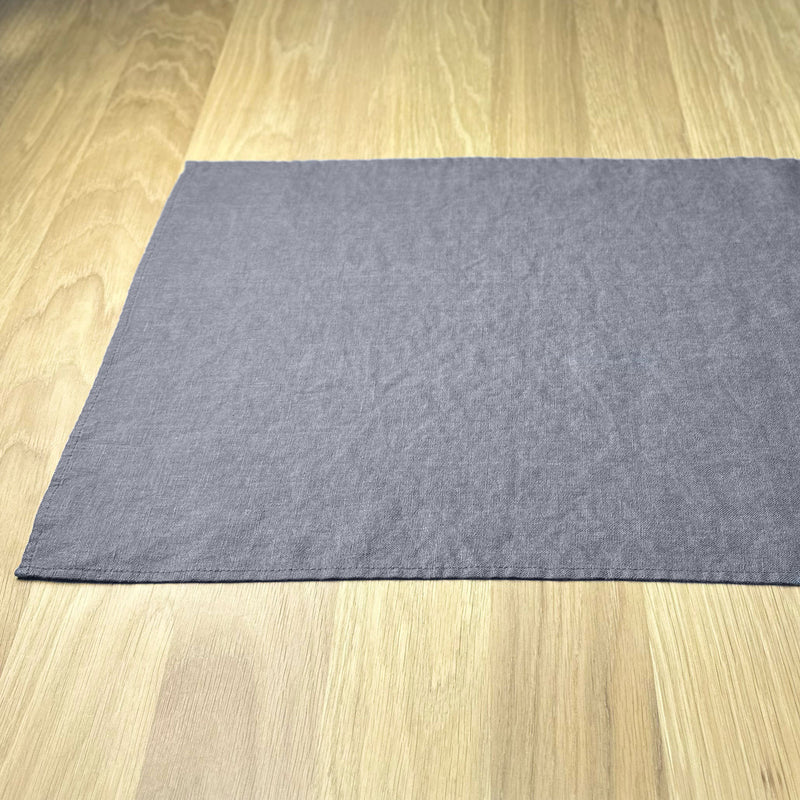 Half-of-Anthracite-gray-linen-placemat-on-wooden-table