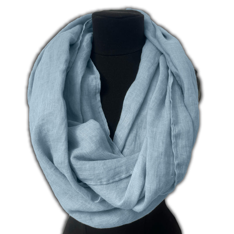Infinity scarf pastel blue on clothing mannequin