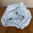 Linen fitted sheet ice blue on wooden box 7