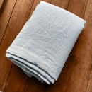 Linen flat sheet ice blue on wooden box 1