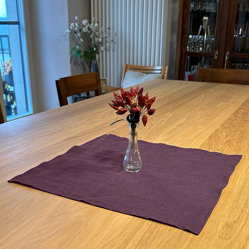 Linen-placemat-aubergine-and-peppers-flowers-on-wooden-table