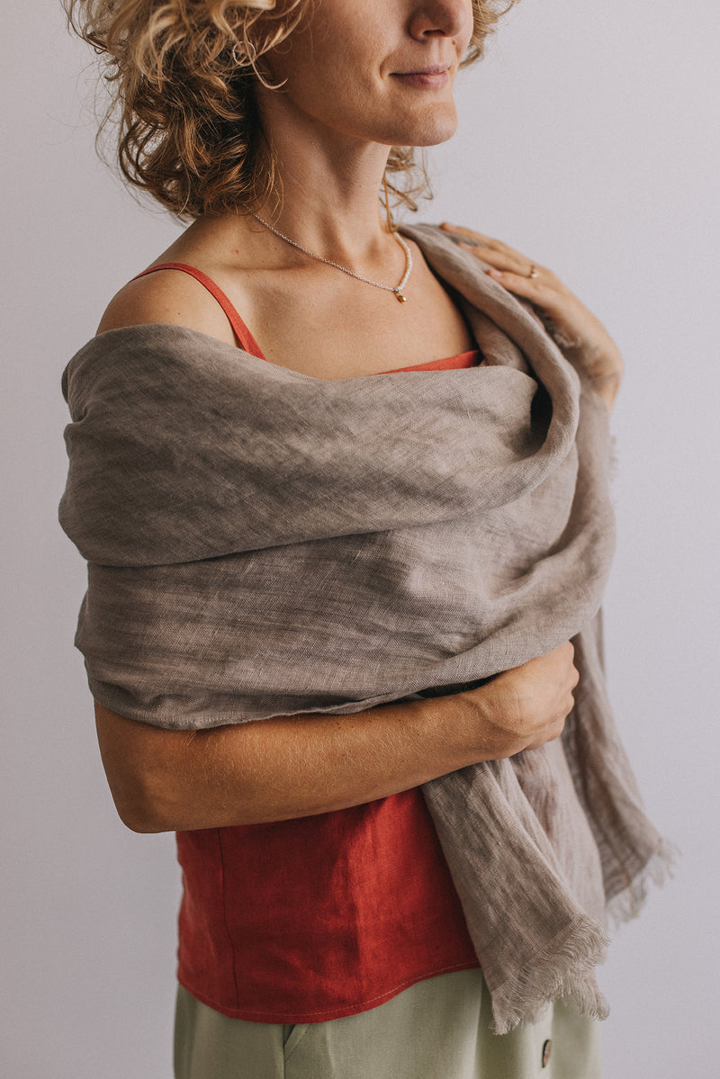 woman in gray Linen scarf and red t-shirt