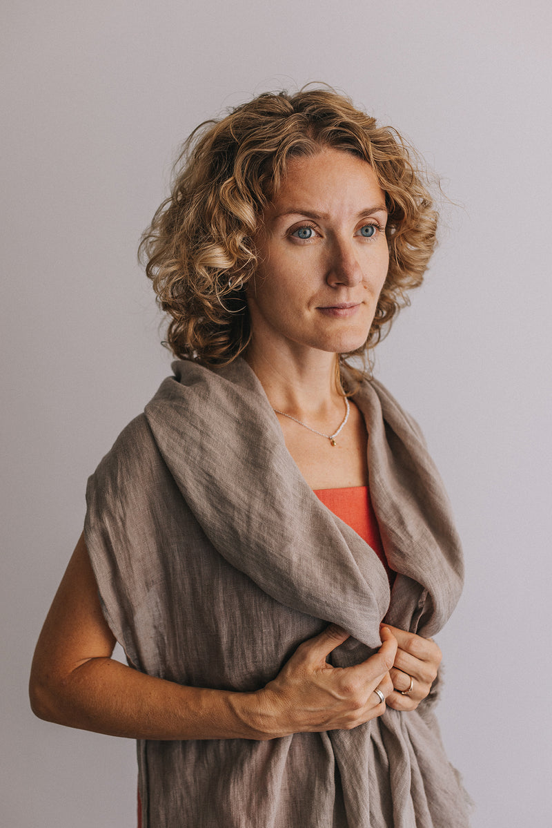 woman in gray Linen scarf and red t-shirt