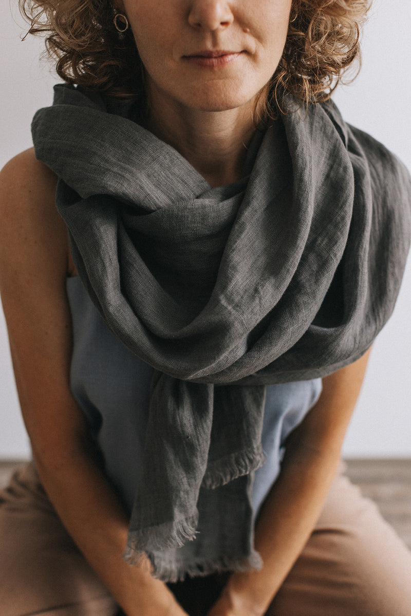 woman in dark gray Linen scarf and blue t-shirt