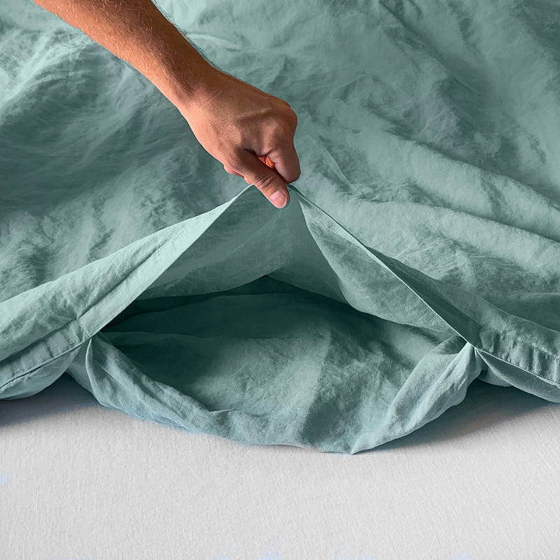 Linen duvet cover turquoise with envelope closure opening by hand