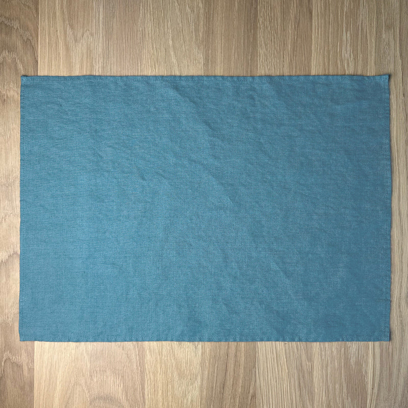 Petrol-linen-placemat-on-wooden-table