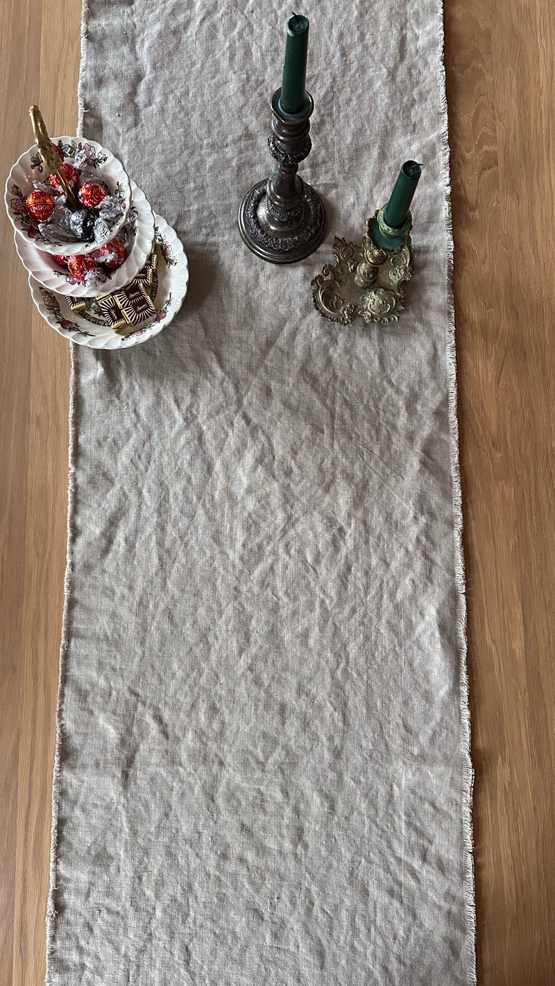Gray Linen table runner with candles and candies
