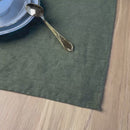 Plate-with-Man-and-woman-on-green-linen-placemat-on-wooden-table