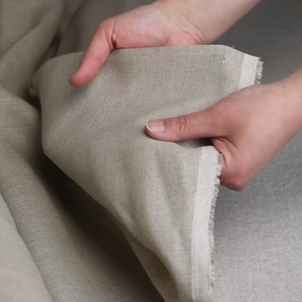 Hands touch Gray linen fabric